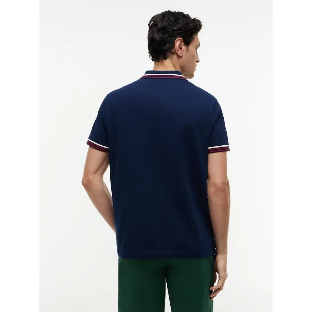 Tommy-Hilfiger_miesten-tummansininen-pikeepaita-kontrasikauluksella-ja-hihansuilla